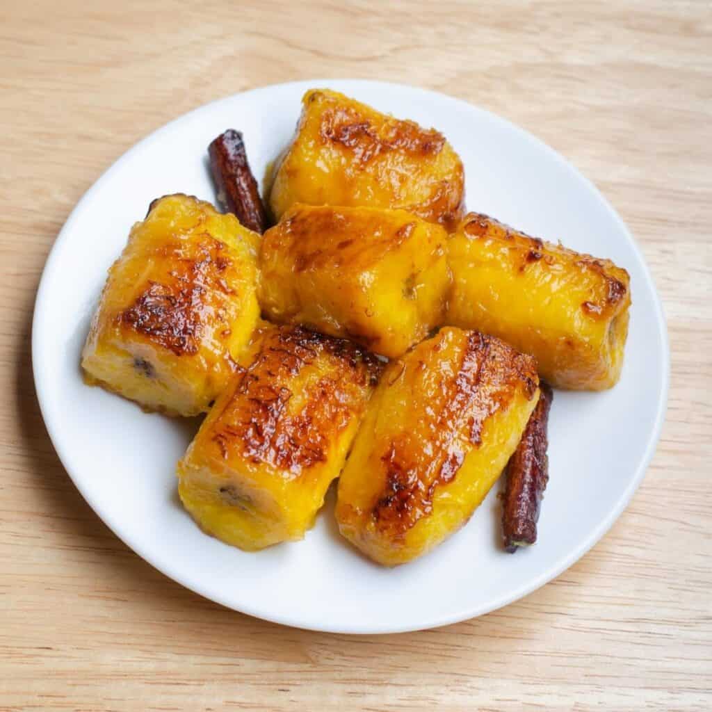 cooked pieces of diced plantains on a white plate