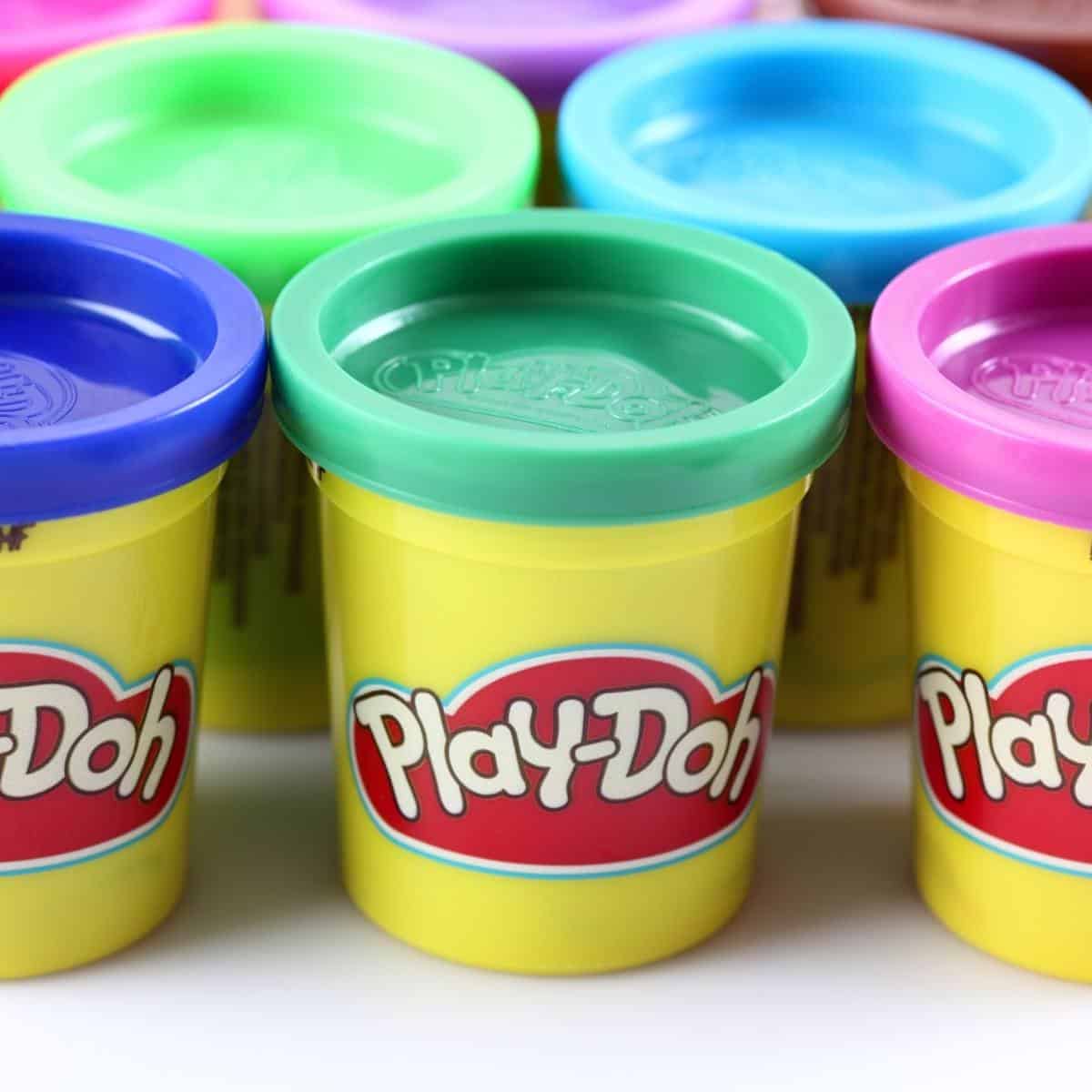 different colored containers of play doh