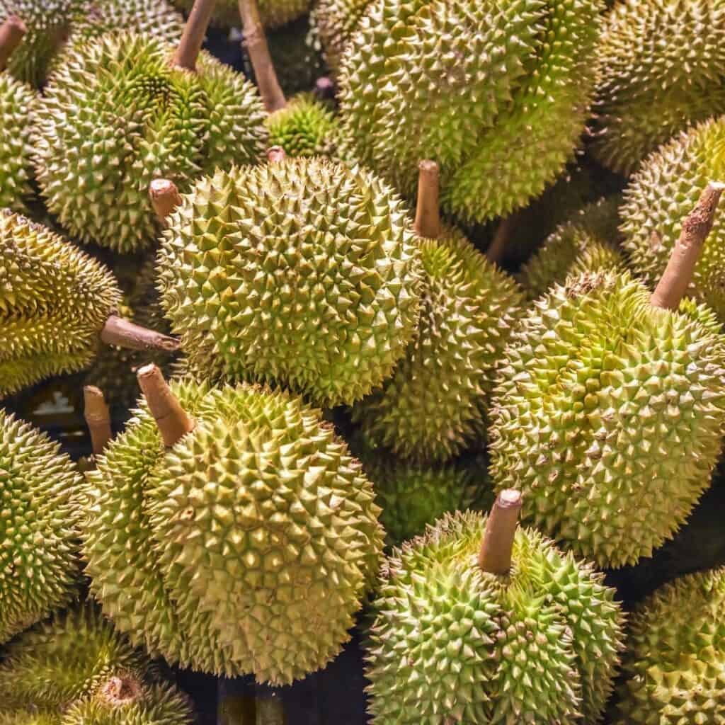 whole durians stacked on each other